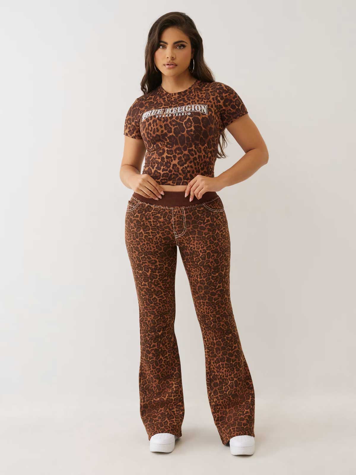 woman wears true religion cheetah print baby tee and sweatpant set